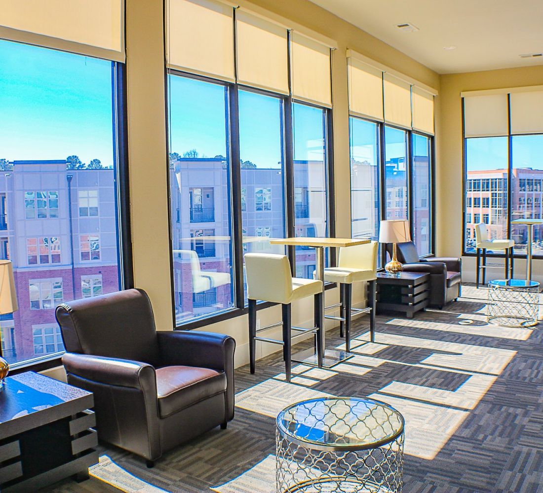 Apartments at Palladian Place with sky lounge, tables, chairs, and a view