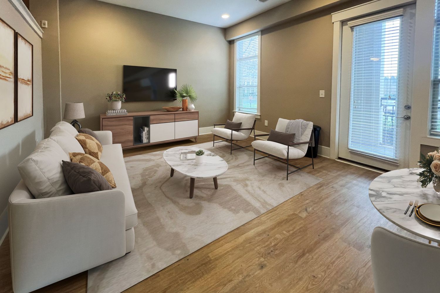 Apartments at Palladian Place in Durham, NC apartment interior living room with a couch, chairs, coffee table, TV, and a rug