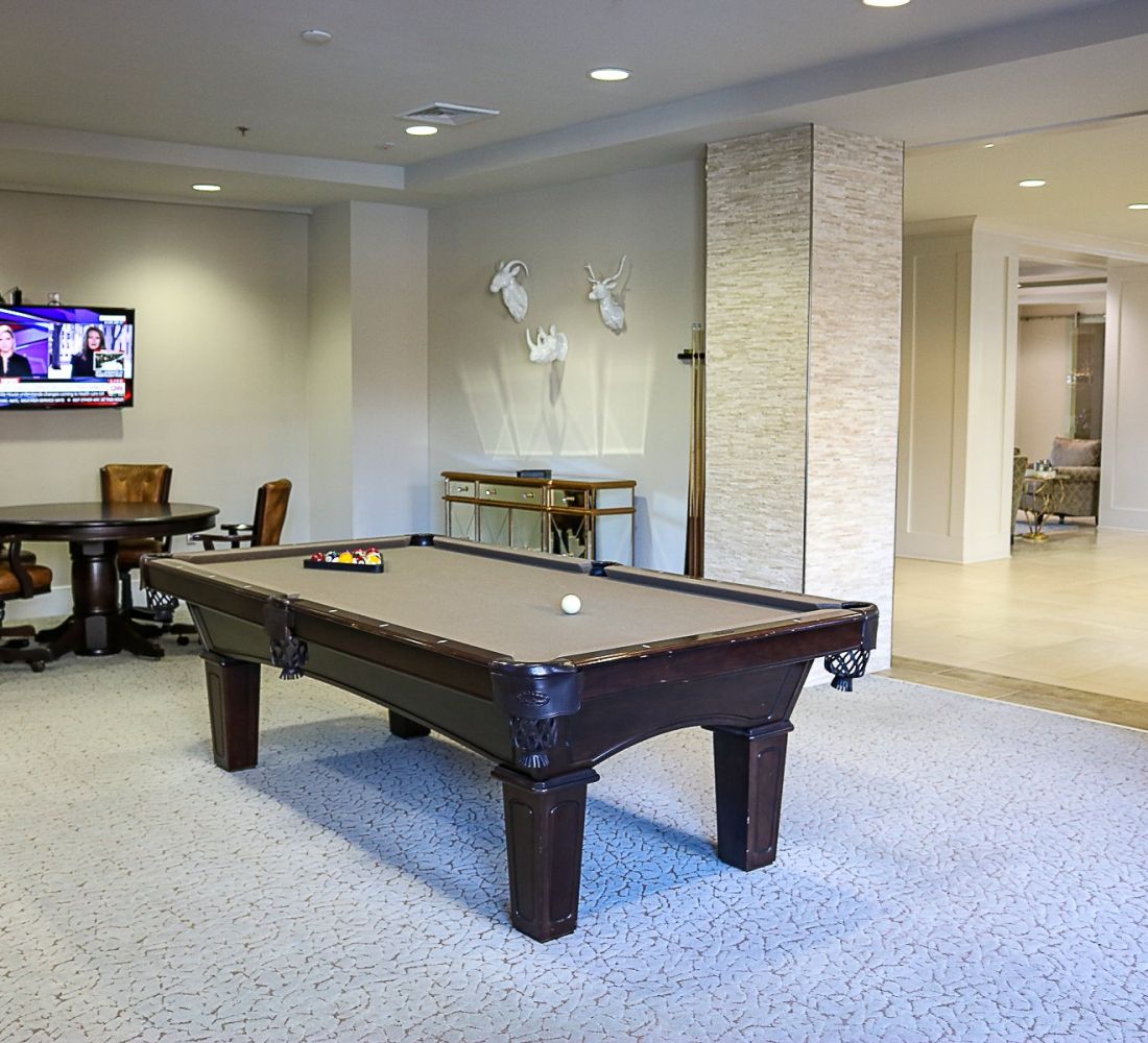 Apartments at Palladian Place with game room and billiards table and TV