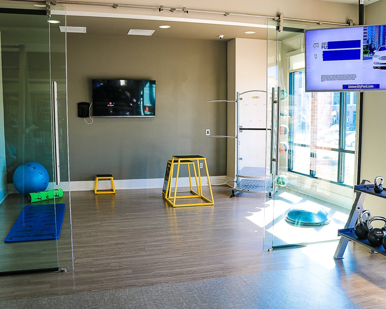 Apartments at Palladian Place with a workout and yoga room with equipment and a TV