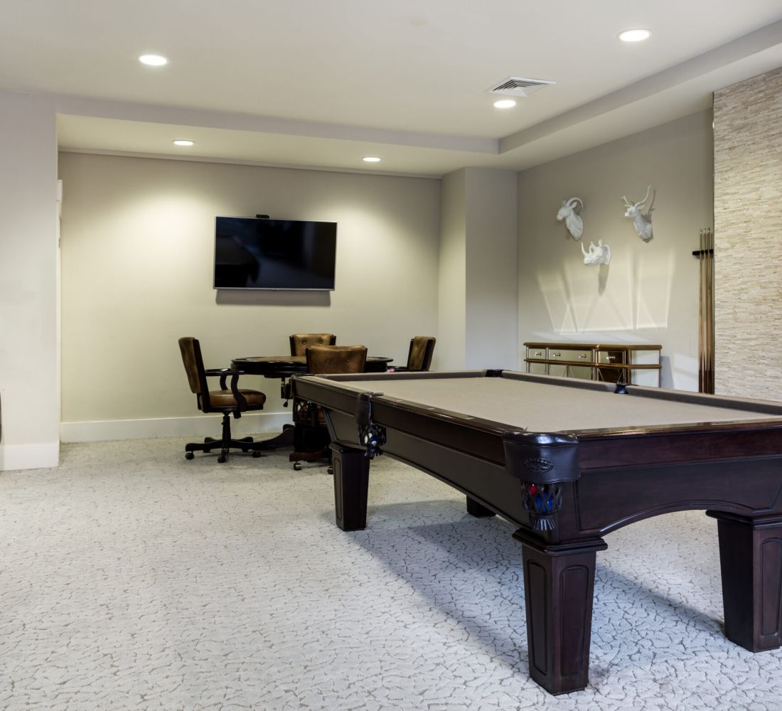 Apartments at Palladian Place with game room and billiards table and TV