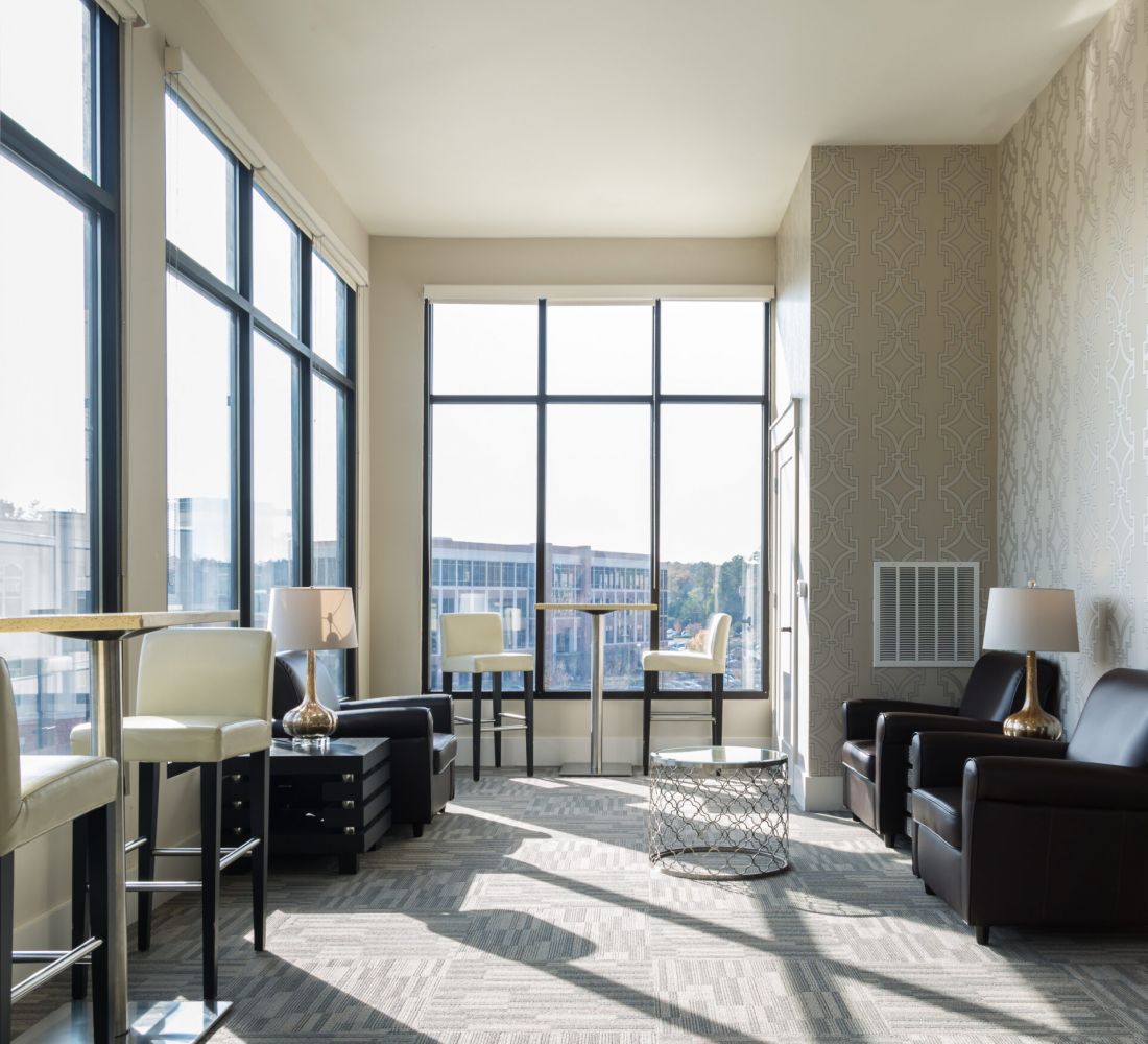 Apartments at Palladian Place with sky lounge, tables, chairs, and a view