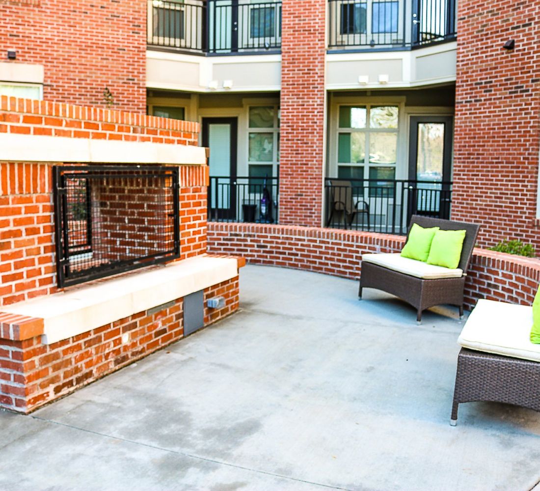 Apartments at Palladian Place with large outdoor brick fireplace