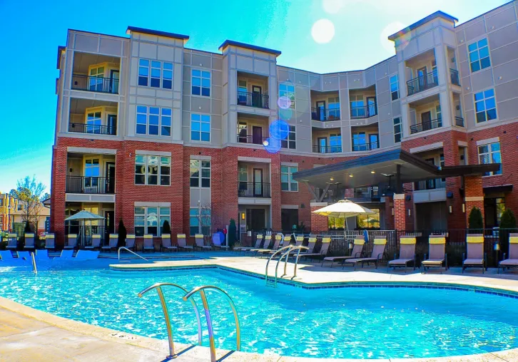 Apartments at Palladian Place building exterior and sparkling pool