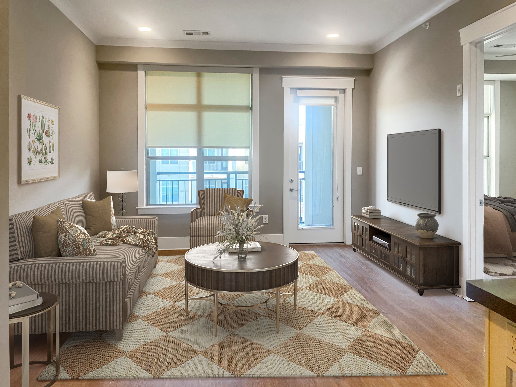 Apartments at Palladian Place in Durham, NC apartment interior living room with a couch, chairs, a rug, and coffee table, and a TV
