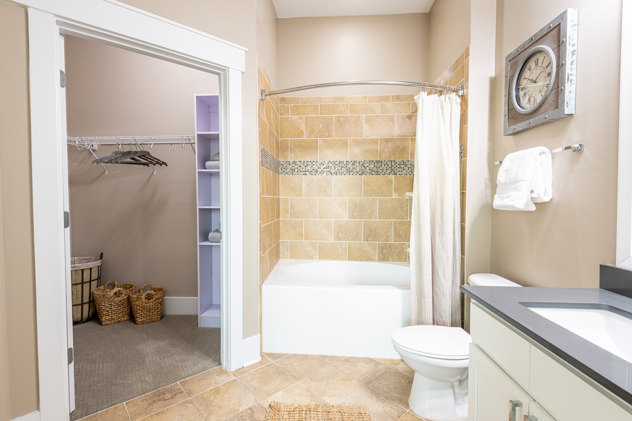 Apartments at Palladian Place in Durham, NC apartment interior bathroom with bathtub, shower, and his and hers vanities