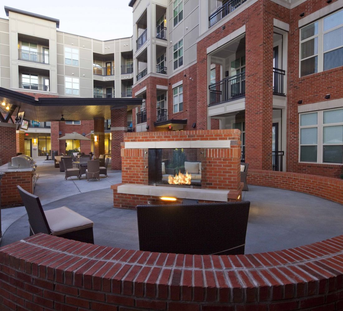 Apartments at Palladian Place with large outdoor brick fireplace