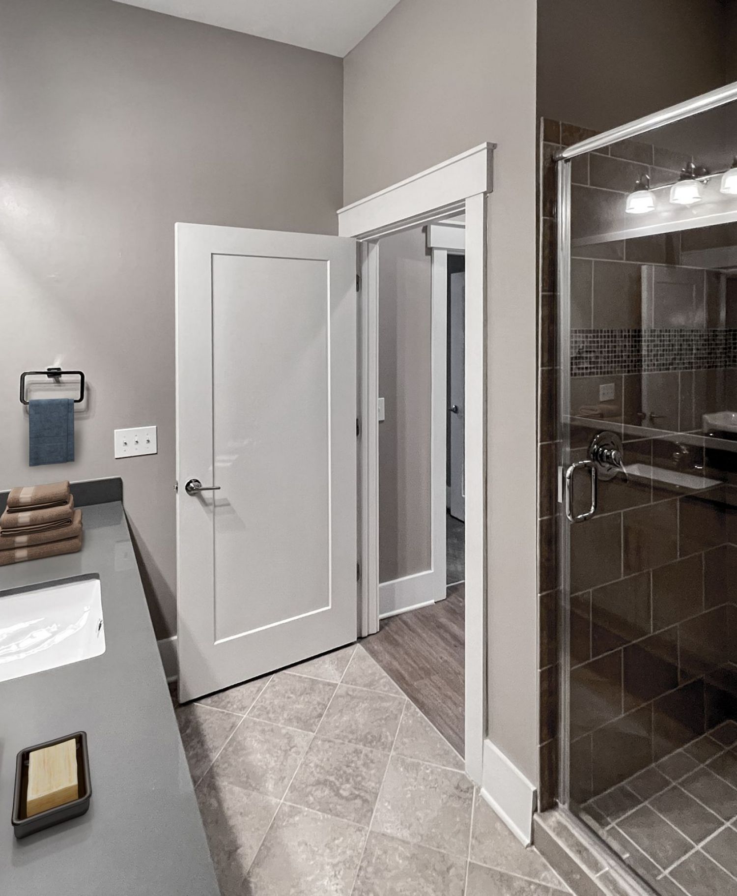 Apartments at Palladian Place in Durham, NC apartment interior bathroom with ceramic tile and glass enclosed shower